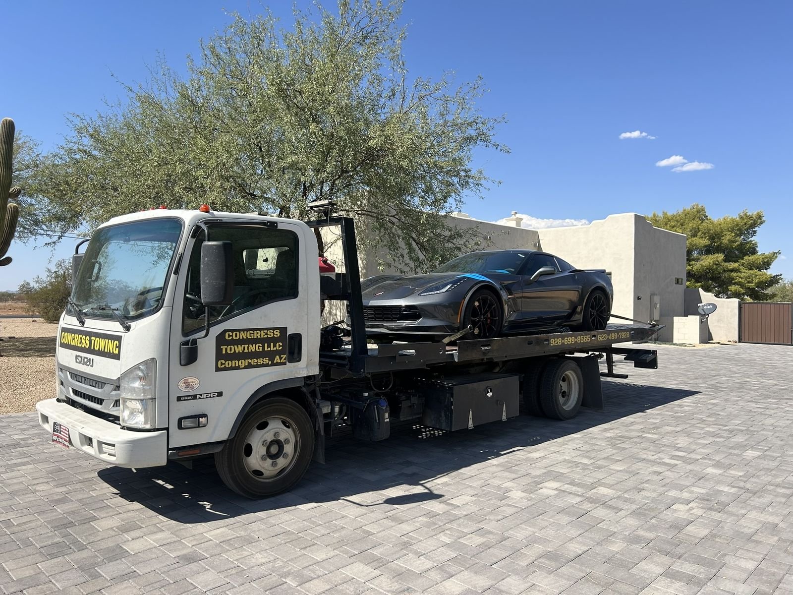 Congress Towing flatbed with a Corvette Grand Sport at a North Valley home
